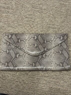 Brave Leather “Animal Instincts” snakeskin/python with signature leopard pocket